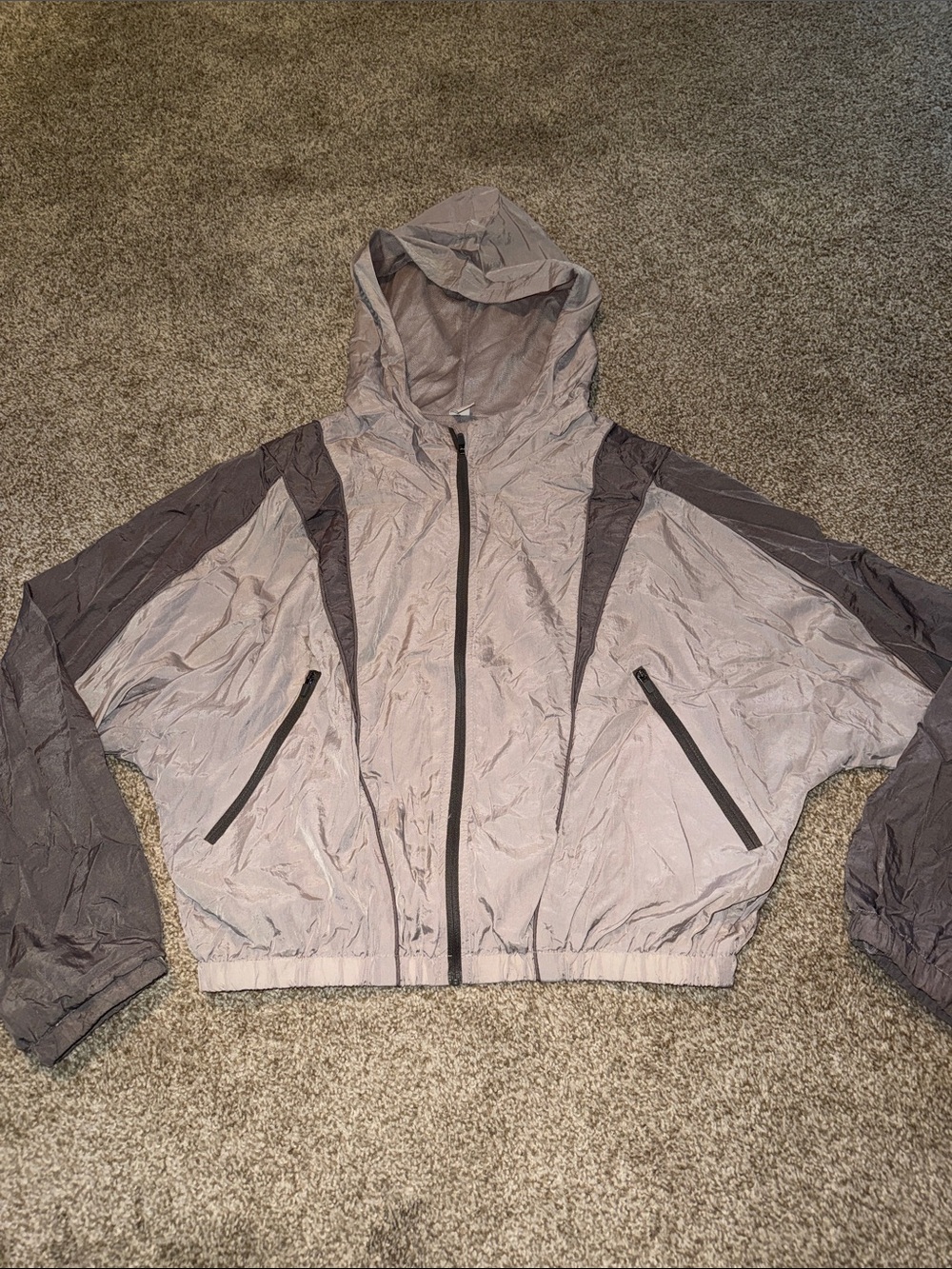 Musera silver and gray cropped, water proof, zip-up, running jacket.